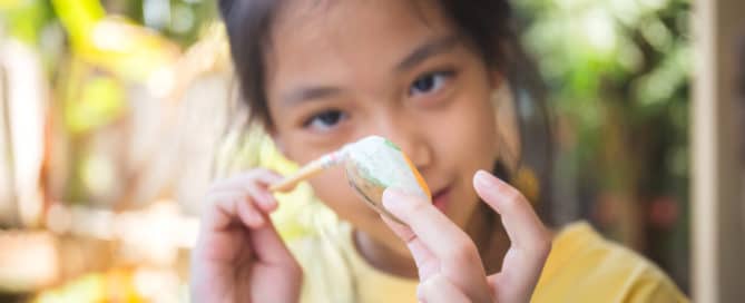 Little Girl doing Rock Paint