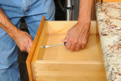 Paint melamine cabinets which are plastic material commonly used to coat chipboard